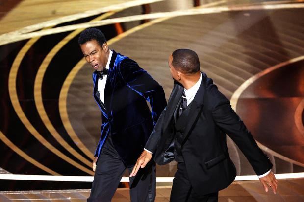 Will Smith slaps Chris Rock onstage during the Oscars telecast 