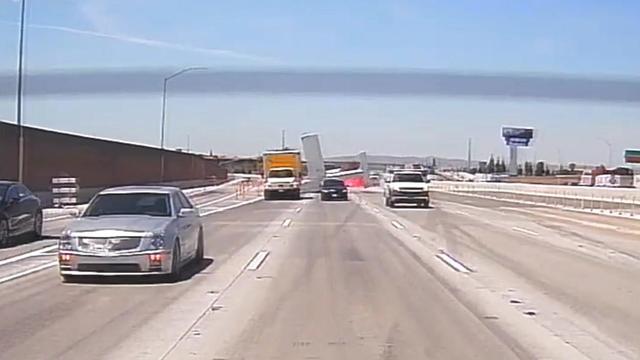 Small plane catches fire after crash-landing on California freeway 