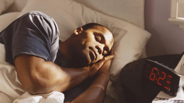 Man Sleeping in Bed 