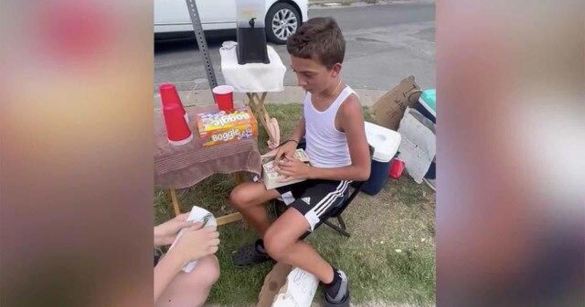 Boy with lemonade stand surprised with donation