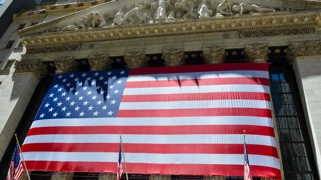 A massive United States flag is seen in Wall Street, New 