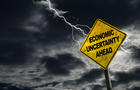 Economic Uncertainty Ahead Sign With Stormy Background 