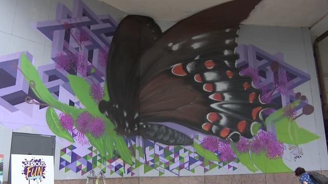 A large mural of a butterfly. 