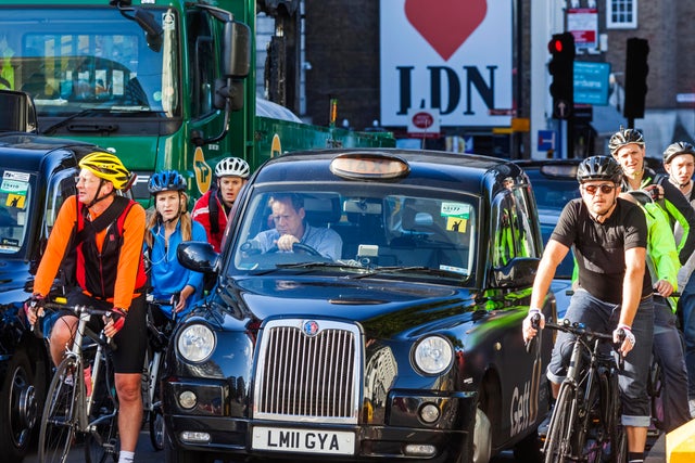 A London Black Cab Taxi Stuck in Traffic 