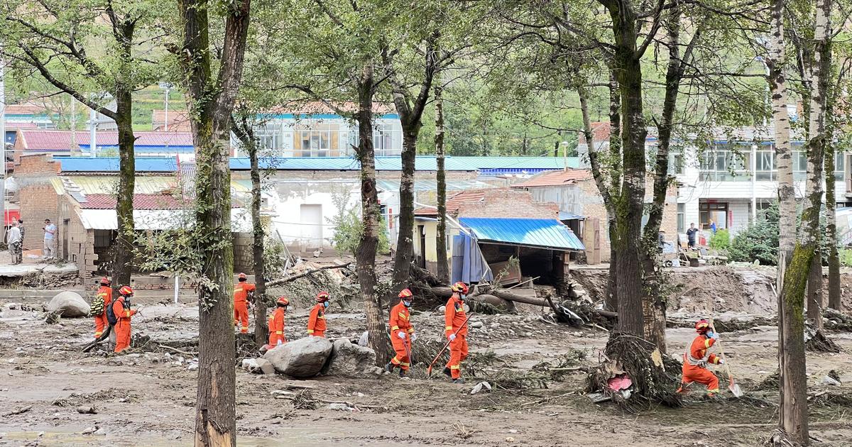 Dozens dead or missing as floods hit western China and heat and drought shut down industry in another region
