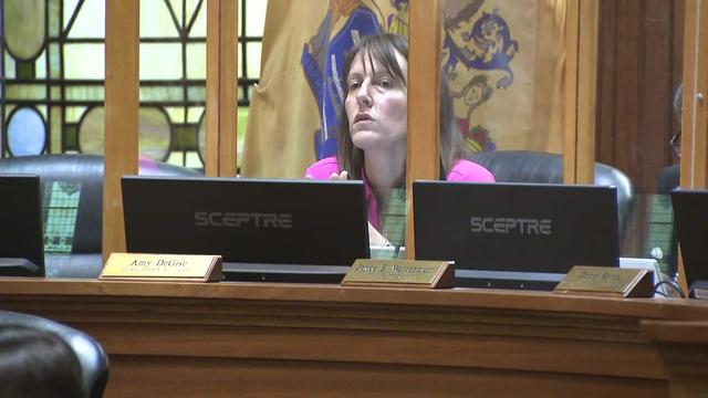 Jersey City councilperson at-large Amy DeGise sits at a desk at a council meeting. 