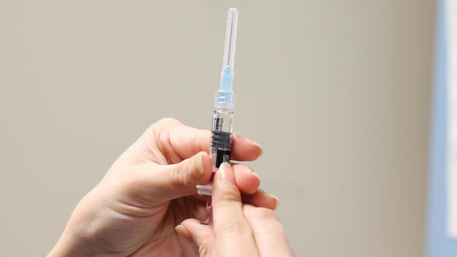 Nurse prepares flu vaccine 
