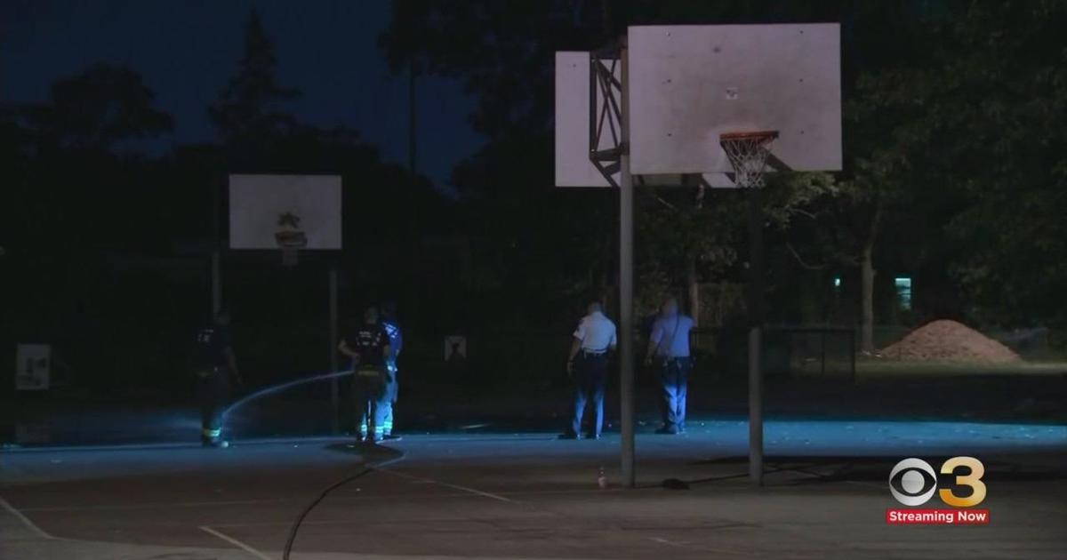 outdoor basketball court at night