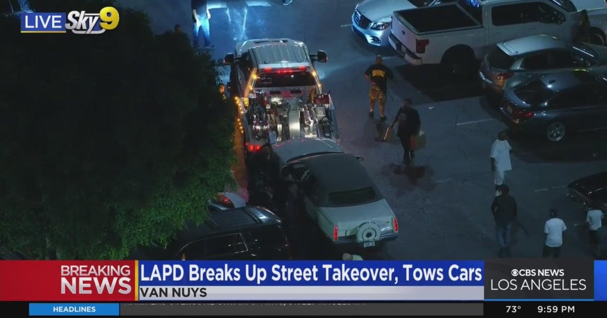 LAPD tows cars after breaking up a street takeover - CBS Los Angeles