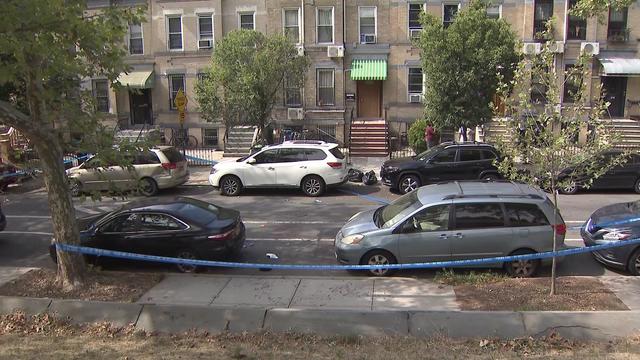 Crime scene tape blocks off part of a street in Brooklyn. 