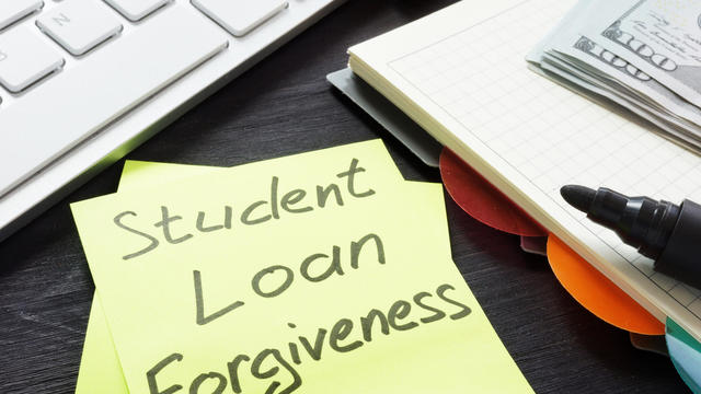 Student loan forgiveness written on a memo stick. 