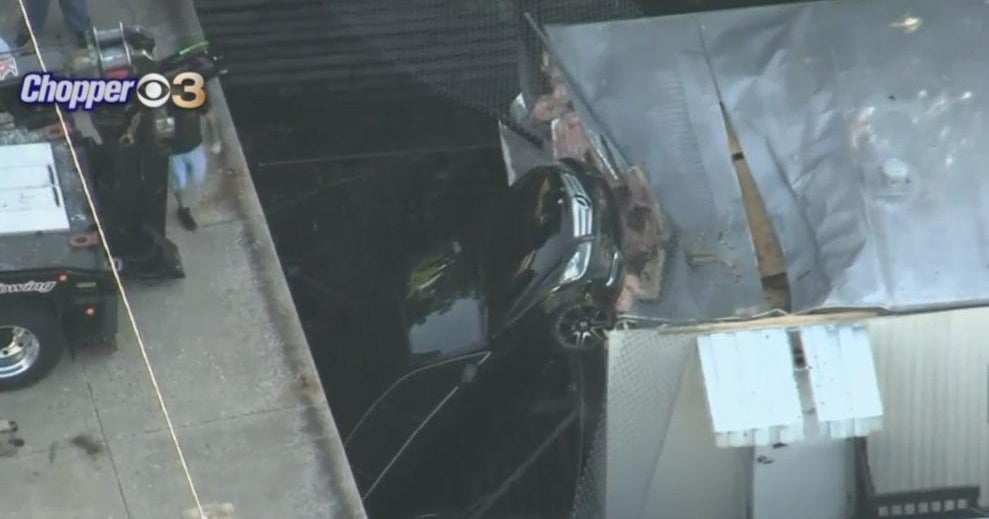 Driver crashes through fence, lands on trailer in Sellersville - CBS ...
