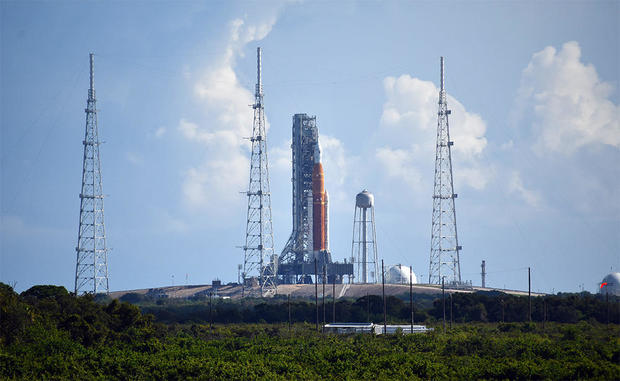 The 322-foot-tall Artemis 1 Space Launch System rocket atop pad 39B at the Kennedy Space Center is seen Aug. 27, 2022, from the roof of the CBS News bureau 4.2 miles away. The countdown began Saturday morning, setting up a launch attempt at 8:33 a.m. EDT on Aug. 29, 2022, the opening of a two-hour window. 