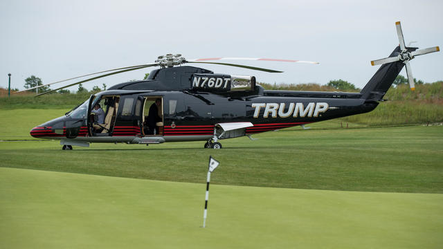 NEW YORK, NY - JUNE 11: A 'TRUMP' branded helicopter sits near a putting green during a ribbon cutting event for a new clubhouse at Trump Golf Links at Ferry Point, June 11, 2018 in The Bronx borough of New York City. 