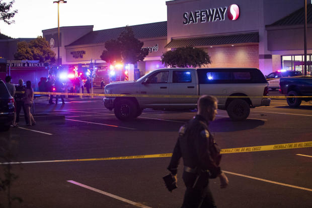 Emergency personnel respond to a shooting at the Forum Shopping Center in Bend, Ore., Aug. 28, 2022. 