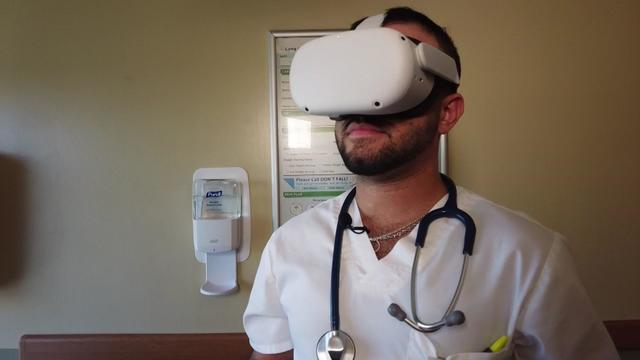 Long Island Jewish Medical Center Forest Hills nurse Ilya Musheyev wears an Oculus Quest 2 headset. 