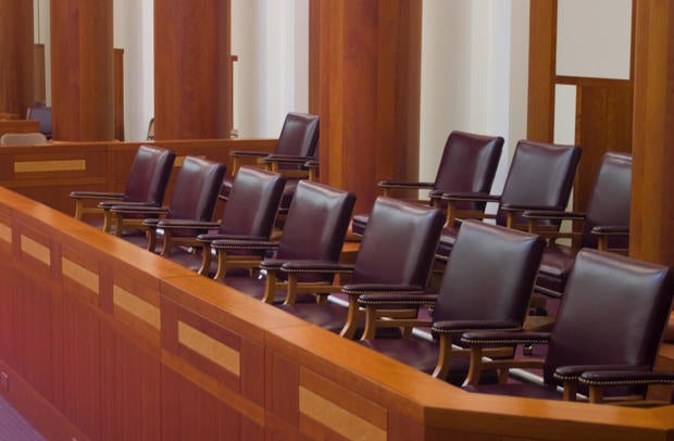 Empty jury box in a courtroom 