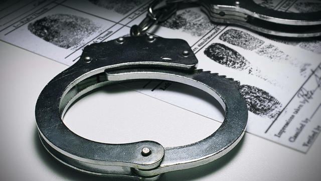 Handcuffs and a suspect's fingerprints 