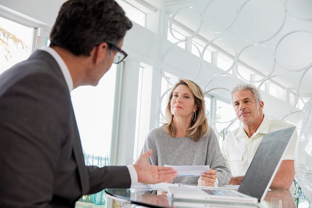 Couple talking to financial advisor 