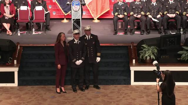 Acting fire commissioner Laura Kavanagh poses for a photograph with two FDNY members. 