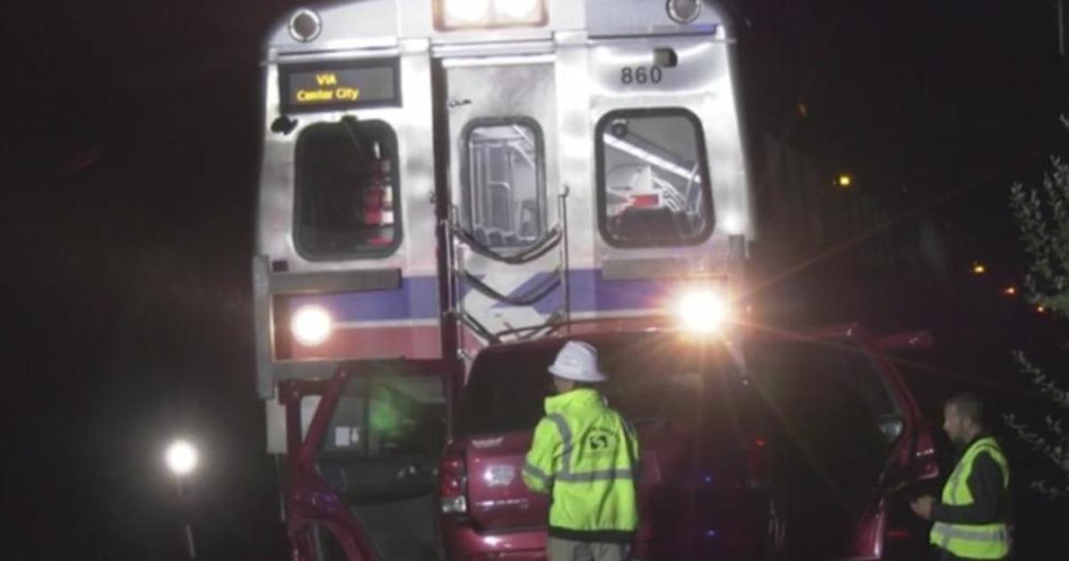 1 hospitalized after train, SUV collide