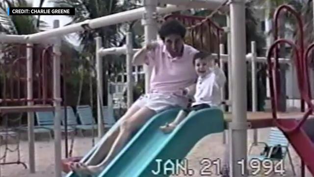 A home video from Jan. 21, 1994, shows a man and a small child sitting on a playground slide, waving at the camera. 