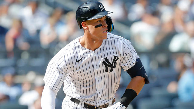 Aaron Judge #99 of the New York Yankees follows through on a sixth inning base hit against the Tampa Bay Rays at Yankee Stadium on September 10, 2022 in the Bronx borough of New York City. 