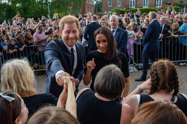 Prince Harry and Meghan greet well-wishers outside Windsor Castle 