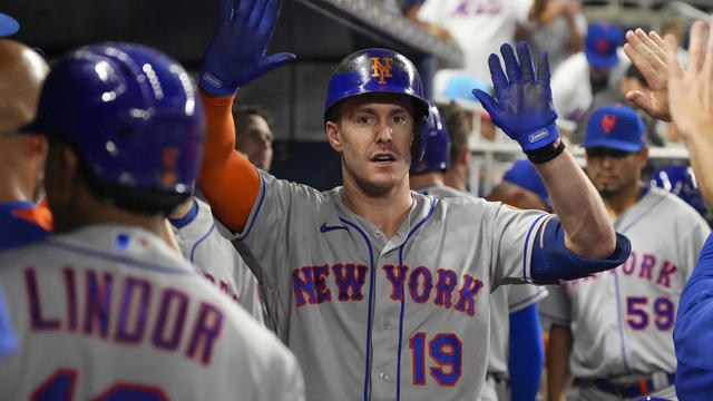 Mark Canha #19 of the New York Mets is congratulated by teammates after hitting a grand slam in the fourth inning against the Miami Marlins at loanDepot park on September 10, 2022 in Miami, Florida. 