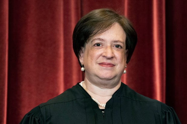 Justice Elena Kagan stands during a group photo at the Supreme Court in Washington, April 23, 2021.