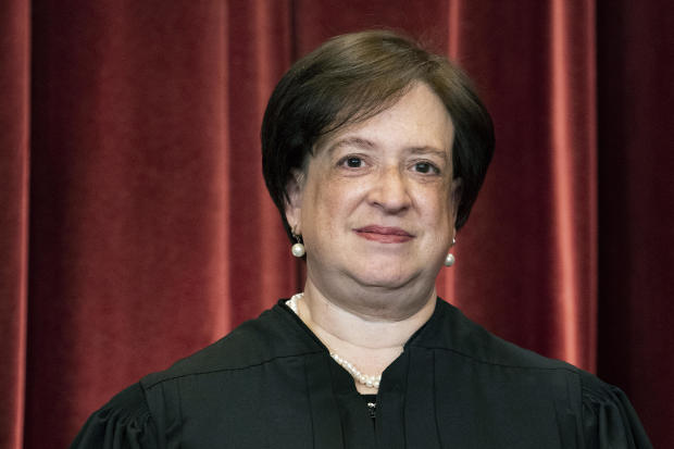 Justice Elena Kagan stands during a group photo at the Supreme Court in Washington, April 23, 2021. 