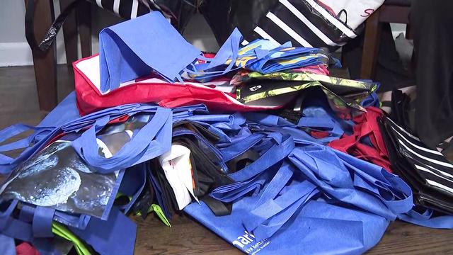 A pile of reusable grocery and tote bags. 