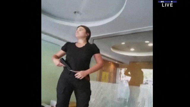 A woman is seen carrying what appeared to be a gun at a Blom Bank branch in Beirut 