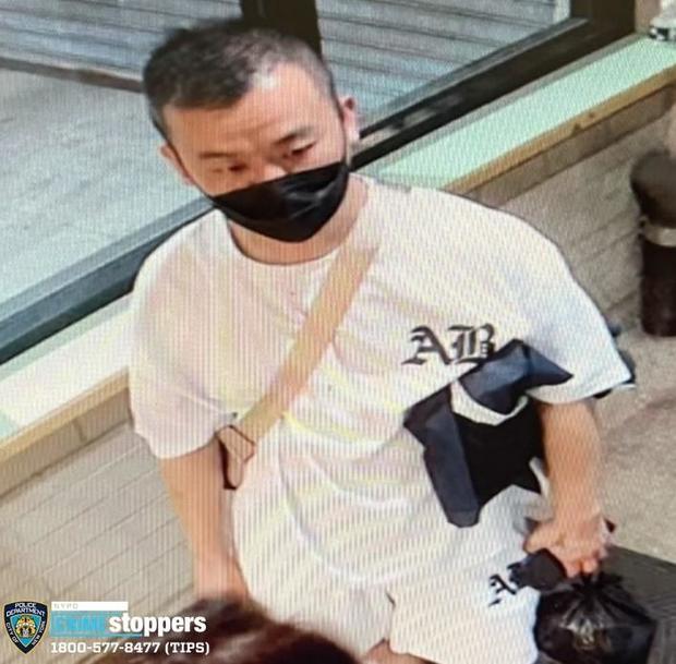 Surveillance photo of a man wanted for question in connection to a deadly stabbing in Queens. 