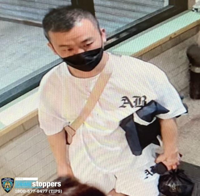 Surveillance photo of a man wanted for question in connection to a deadly stabbing in Queens.