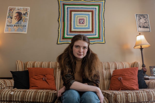 Jaz Brisack sits on a couch looking into camera 