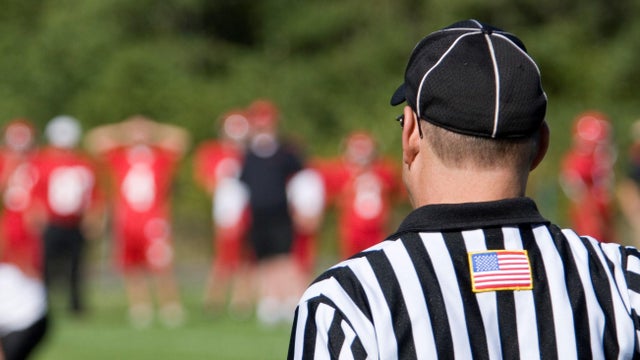 American football referee viewed from the rear at the game 