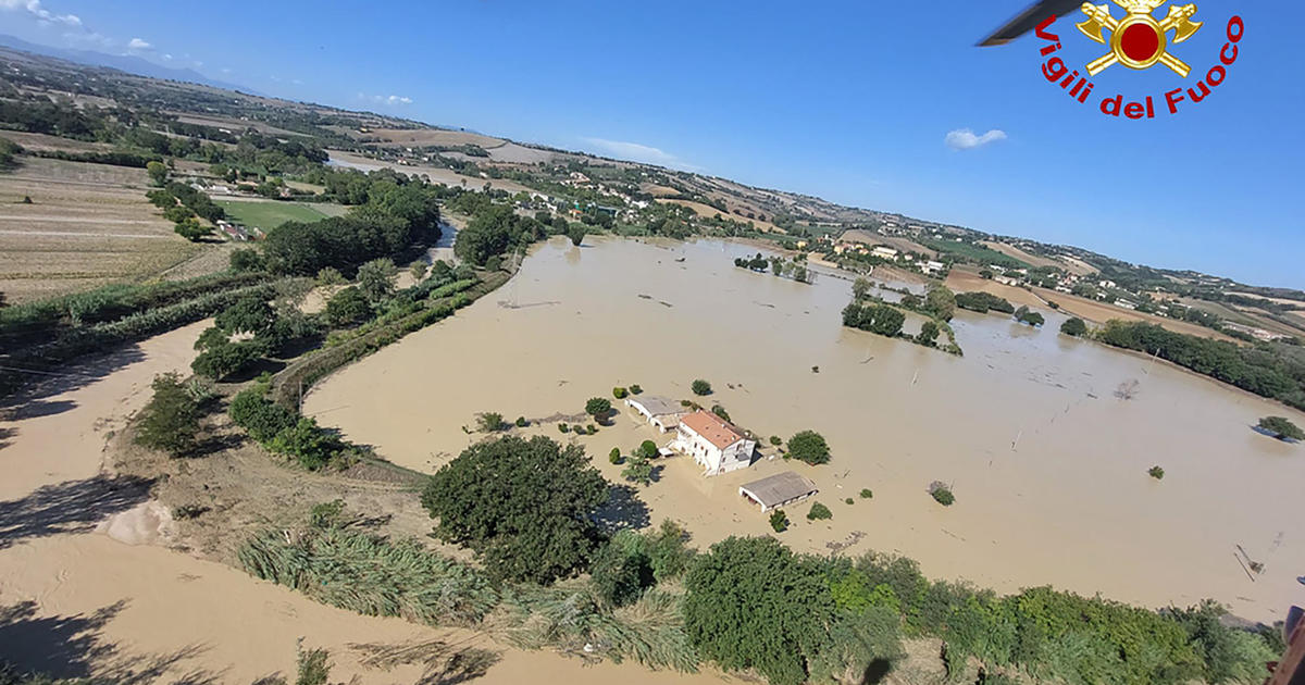 Floods kill at least 10 in Italy as dozens are rescued from rooftops