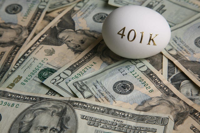 American currency and an egg with '401K' on it 