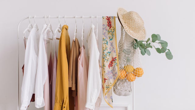 Clothes Hanging In Rack At Home 