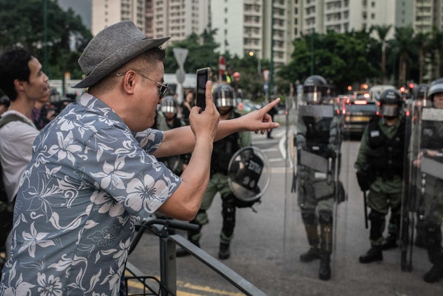 A demonstrator shouts at police during the protests.After 