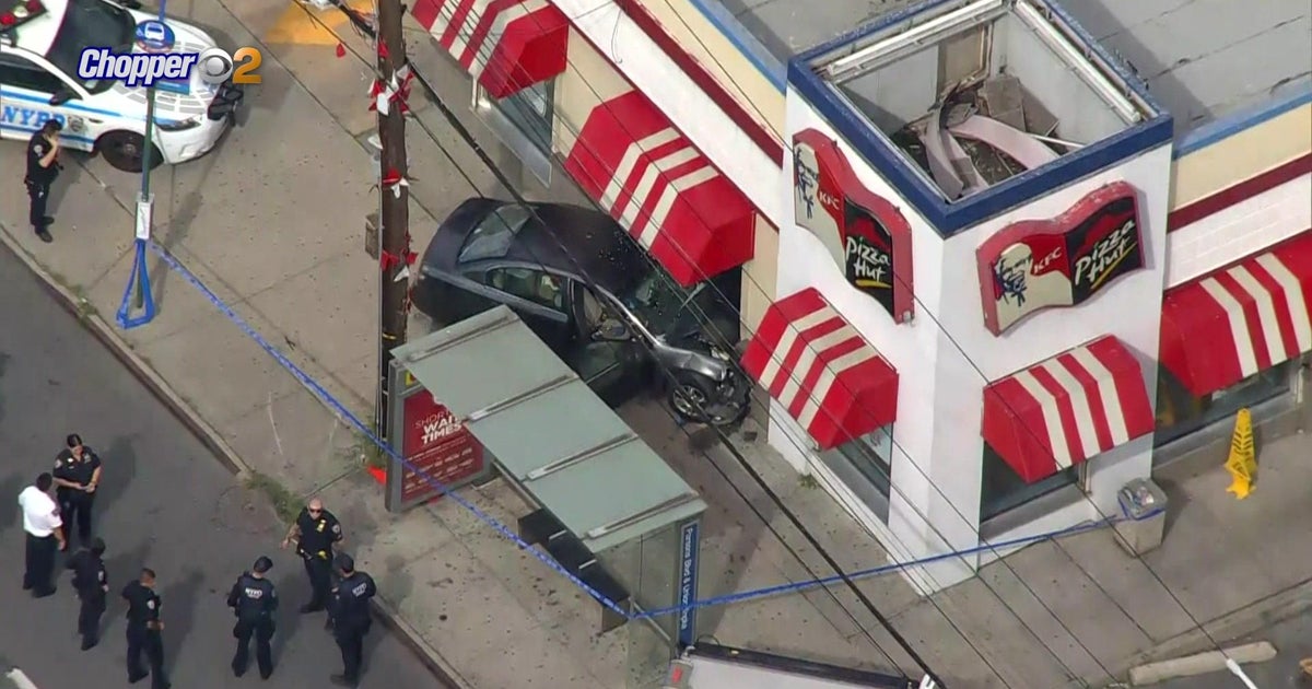 Car crashes into KFC in Queens during attempted carjacking, suspect