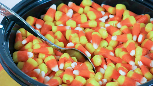 Candy Corn in a serving bowl with spoon for a birthday party dessert 