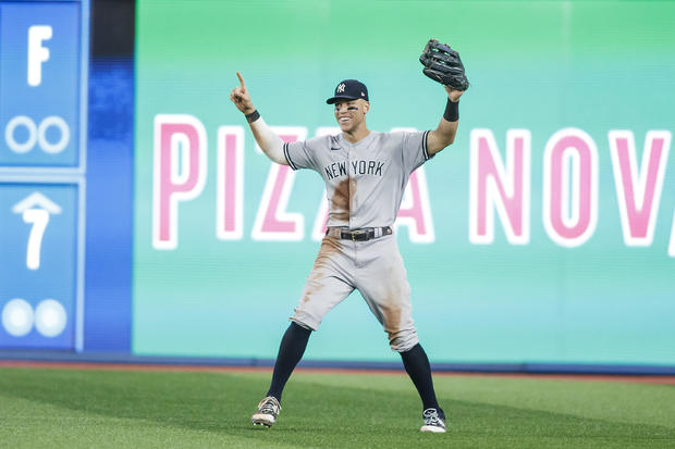 Aaron Judge #99 of the New York Yankees celebrates in the outfield after the last out of their MLB game against the Toronto Blue Jays at Rogers Centre on September 27, 2022 in Toronto, Canada. 