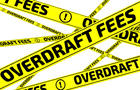 Overdraft fees. Yellow warning tapes 