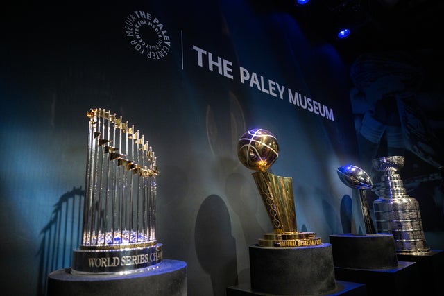The MLB's Commissioner's Trophy, NBA's Larry O'Brien Trophy, NFL's Vince Lombardi Trophy and NHL's Stanley Cup are displayed all together at PaleyWKND outside the Paley Museum on October 01, 2022 in New York City. 