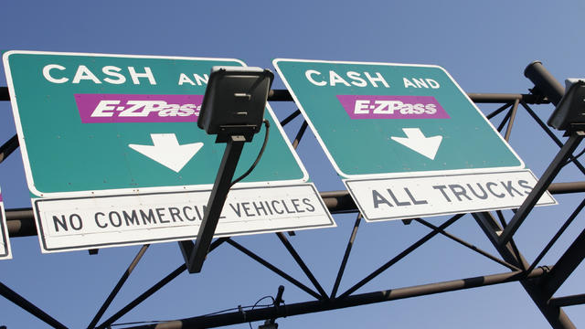 Cash and E-Z Pass signs at the New Jersey Turnpike. 