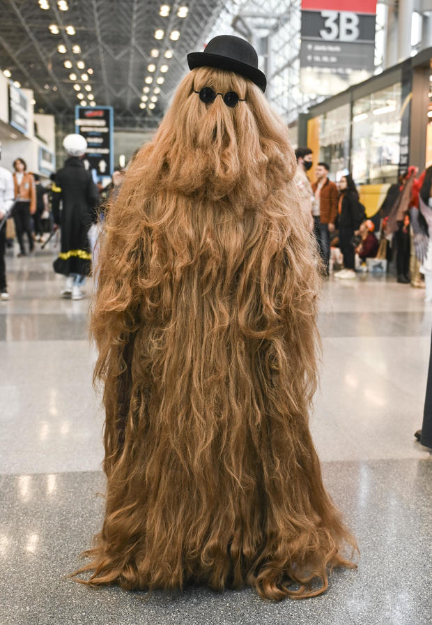 A cosplayer poses as Cousin It during day 2 of New York Comic Con on October 07, 2022 in New York City. 