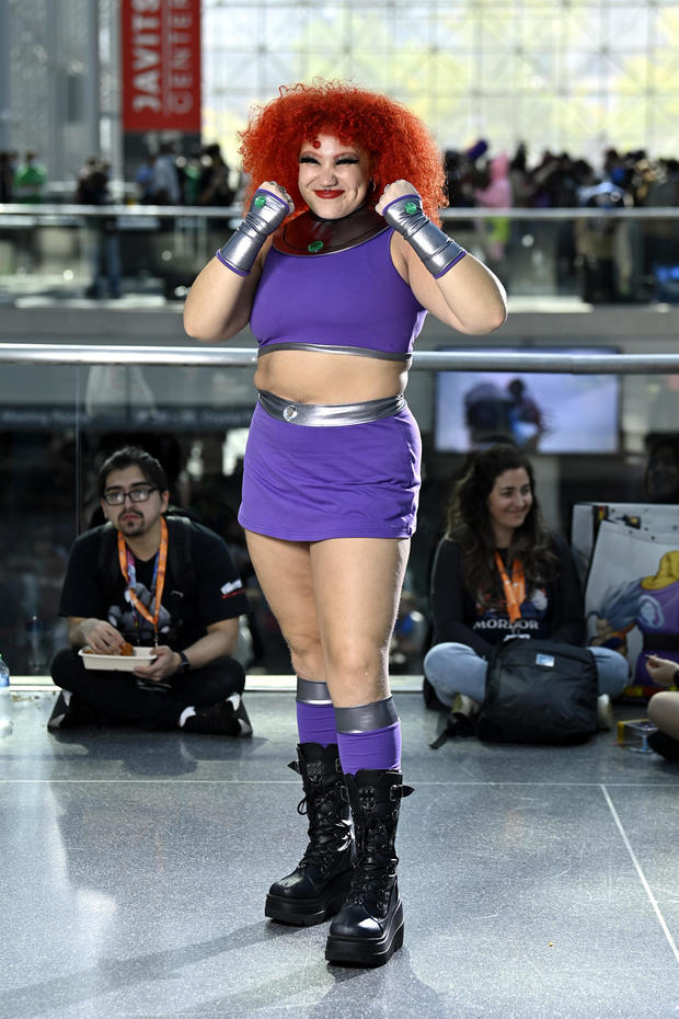 A Starfire cosplayer poses during New York Comic Con 2022 on October 07, 2022 in New York City. 