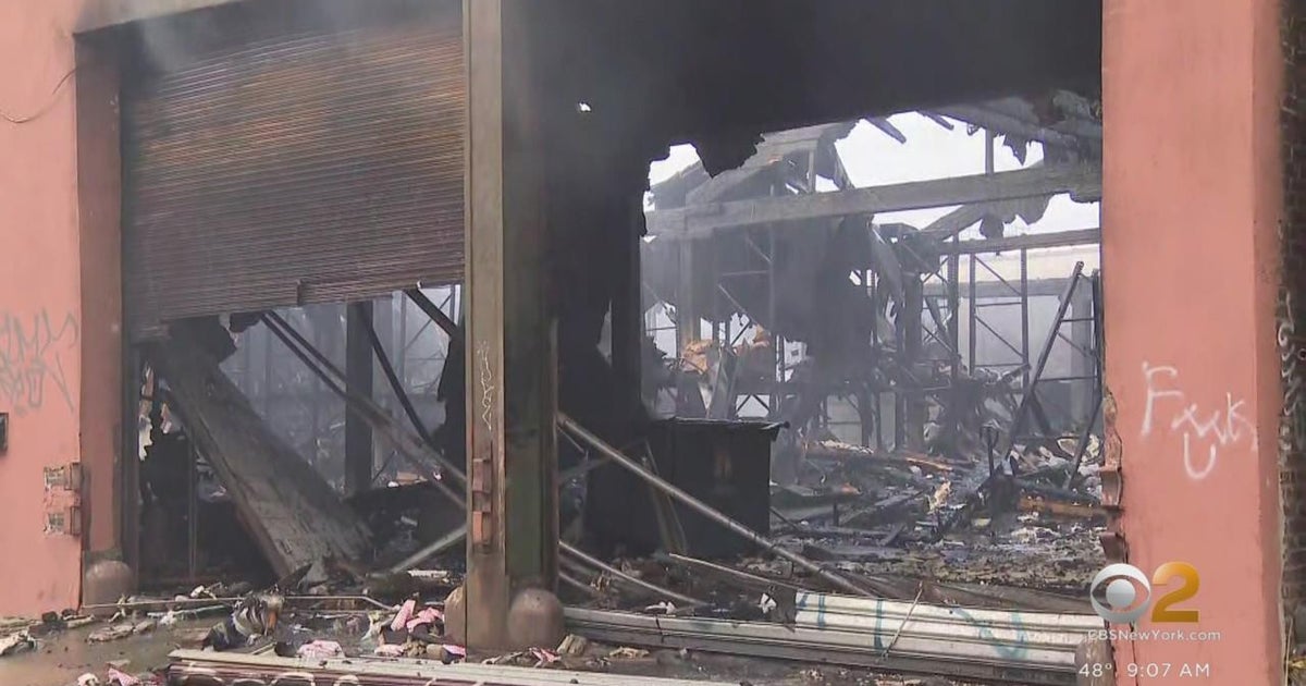 Queens laundromat owner vows to rebuild after fire - CBS New York